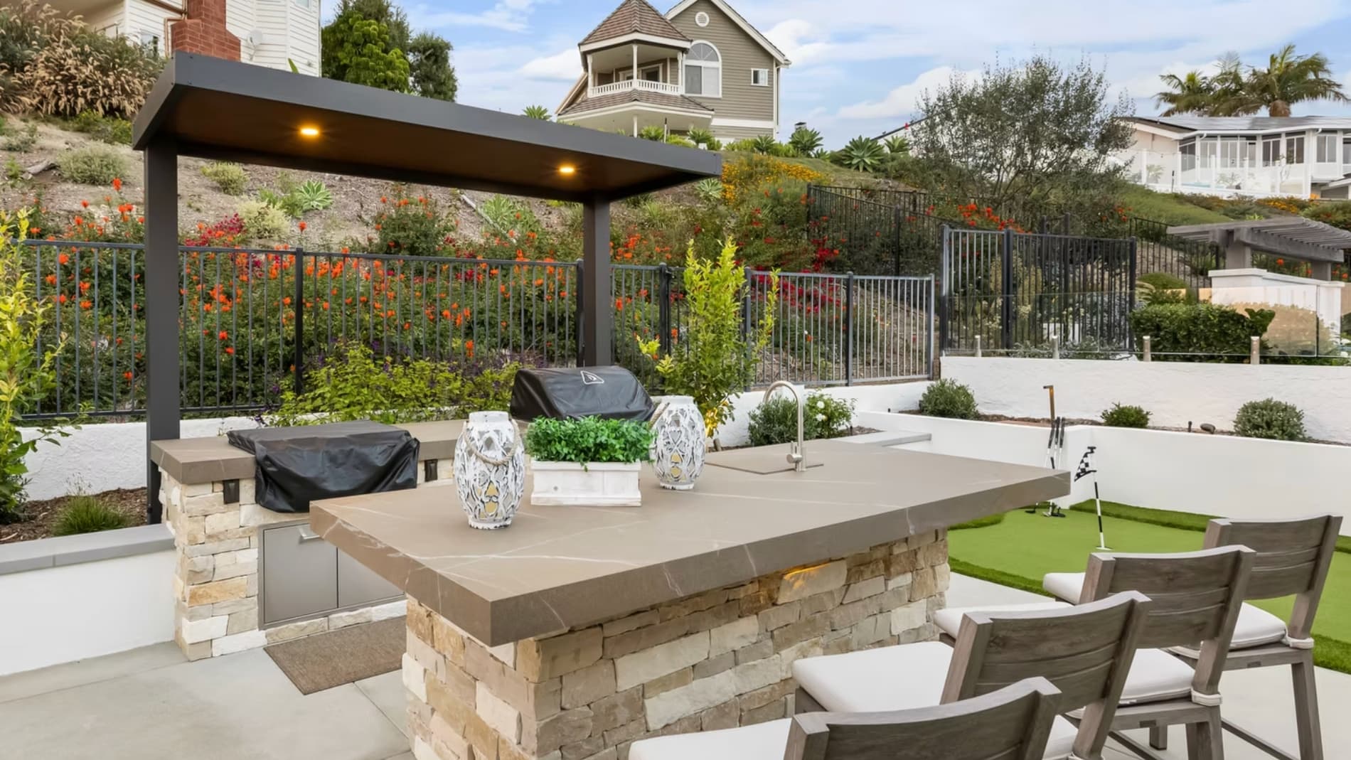 Modern patio cover installation over outdoor entertaining area