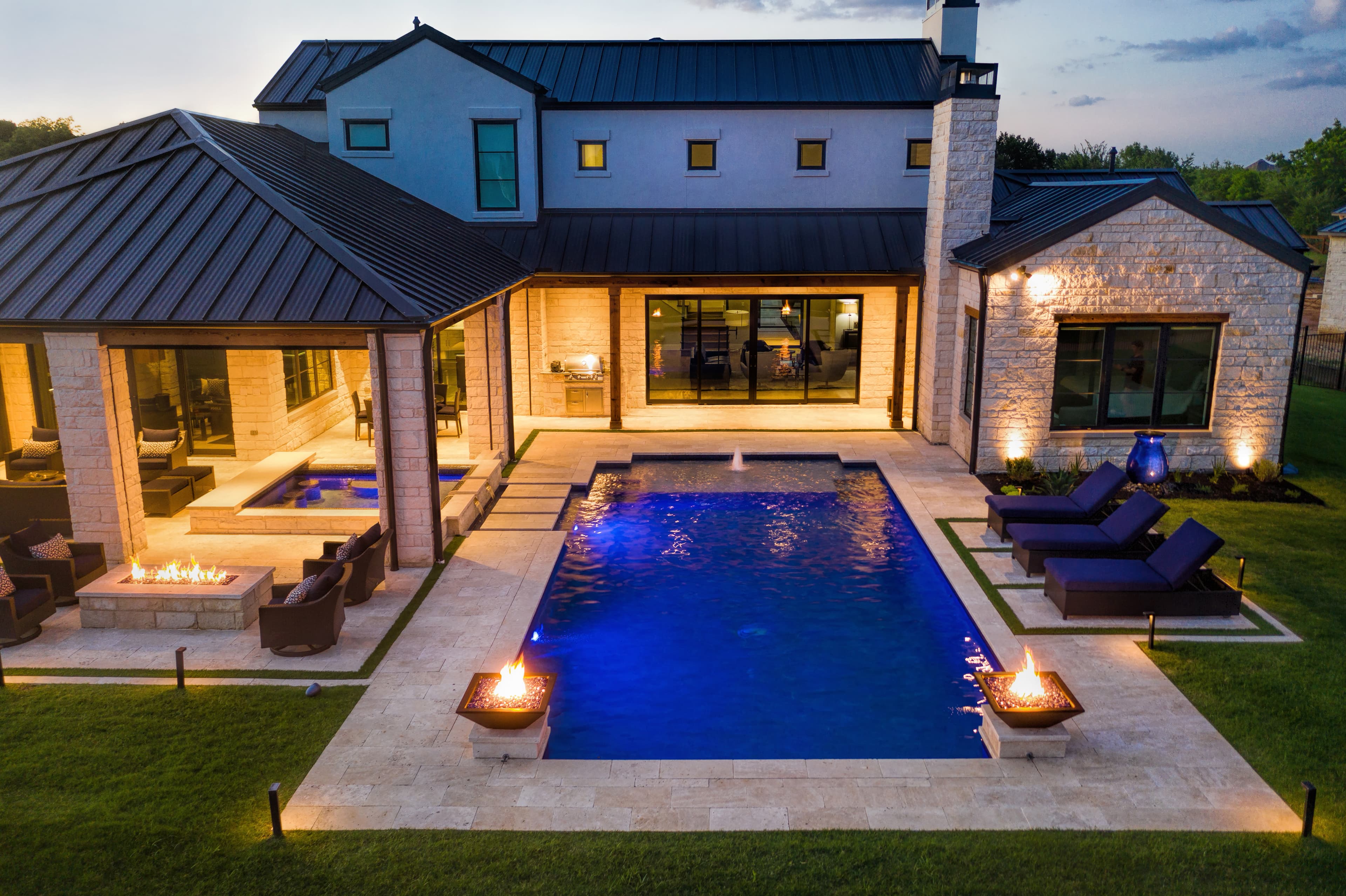 Modern pool with blue glass tile and clean geometric lines